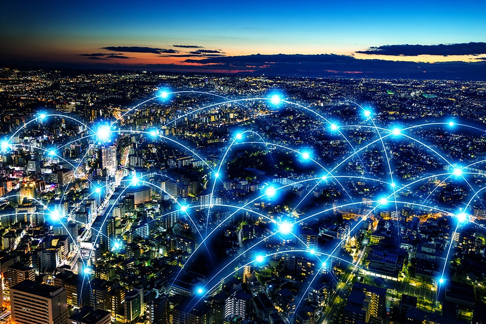 Digital network visualised above cityscape